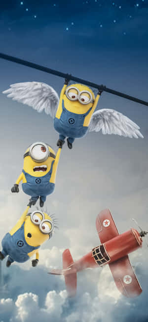 三隻有翼嘅Minions喺星空下追住一架紅色飛機。 — iPhone 18 Pro 壁紙