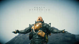 身穿戰術裝備的男子站在山上，張開雙臂，遊戲標題 Death Stranding 在其下方。