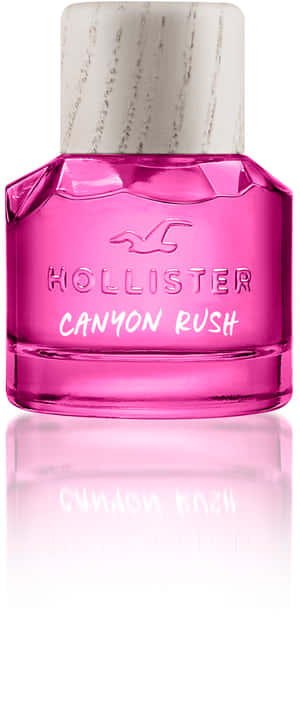 粉紅色Hollister Canyon Rush香水瓶，白色瓶蓋，置於反光表面。