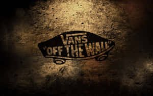 Vans Off The Wall標誌在帶有紋理的混凝土牆上，具有聚光燈效果。