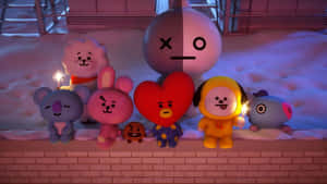 BT21角色在夜晚的積雪壁架上手持煙花棒。