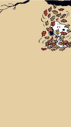 Snoopy 被樹枝下飄落的秋葉覆蓋。