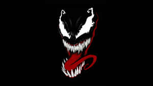 Venom的臉上帶有鋒利牙齒和紅色舌頭，在黑色背景上。 — 超自然 GIF 壁紙