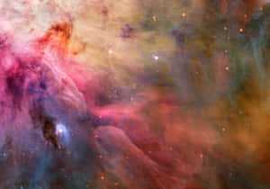 充滿活力的宇宙星雲，在深空中擁有發光的恆星和旋轉的粉紅色、橙色、藍色氣體。
