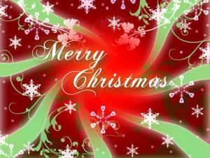 Merry Christmas文字被旋轉的紅綠圖案和雪花包圍