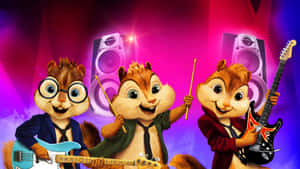三隻花栗鼠在色彩繽紛的舞台上演奏樂器。 — 阿爾文與_chipmunks 壁紙