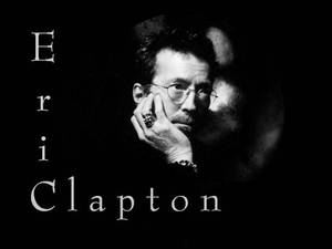 Eric Clapton 的黑白肖像照，戴著眼鏡，手托下巴。 — 黑白 壁紙