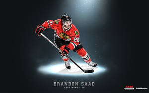 冰球運動員 Brandon Saad 穿著紅色 Blackhawks 裝備在聚光燈下滑行。