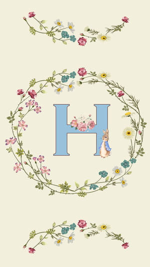 字母H被花環環繞，帶有兔子插圖。 — 唯美花朵動圖 壁紙