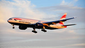 英國航空噴射機喺日落時放低起落架降落
