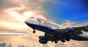 英國航空珍寶客機飛過色彩繽紛的日落雲層。