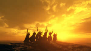 一群奇幻戰士在金色日落時分於山丘上形成剪影 — 史詩 壁紙