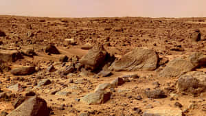 朦朧天空下火星表面的岩石和沙子。 — 火星 GIF 壁紙