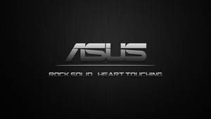 ASUS 標誌附有標語 rock solid heart touching，背景為紋理黑色。