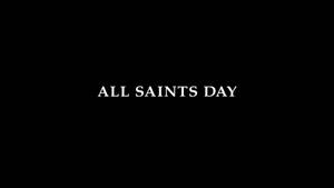 黑色背景上居中顯示白色文字「All Saints Day」。