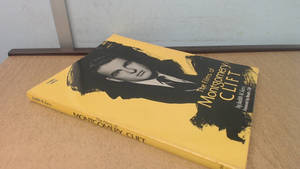 關於 Montgomery Clift 的黃色書本，在木質表面上 — 荷里活 GIF 壁紙