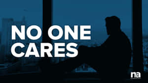 一個男人坐在窗邊的剪影，上面有文字 no one cares。