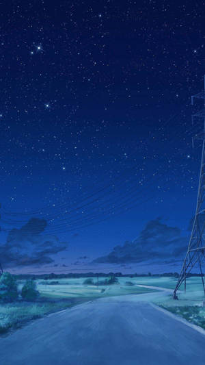 星空下的蜿蜒道路，有電線和一座塔。