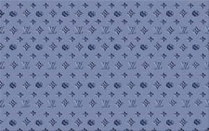 帶有重複 Louis Vuitton 字母組合圖案嘅藍色紋理布料。