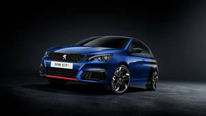 藍色Peugeot 308 GTI跑車在工作室中，帶有紅色點綴和黑色車輪。