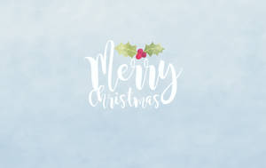 藍色背景上的白色草書Merry Christmas，帶冬青和漿果