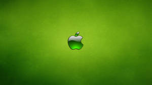 光澤Apple標誌在綠色紋理背景上
