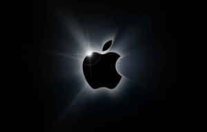 Apple標誌在黑暗背景上發光並帶有光線