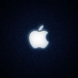 發光Apple標誌在深藍色紋理背景上