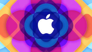 Apple標誌被色彩繽紛的重疊幾何形狀包圍。