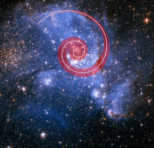 一個螺旋星系在星空背景下用紅色虛線輪廓突出顯示。 — 銀河 壁紙
