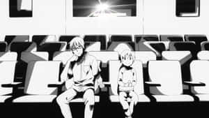 兩個動漫男孩坐在空劇院裡，頭頂有一盞明亮的燈。