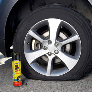 扁平車胎同Fix a Flat罐喺路面