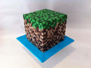 藍色底座上的像素化Minecraft草地磚蛋糕 — 甜品 壁紙