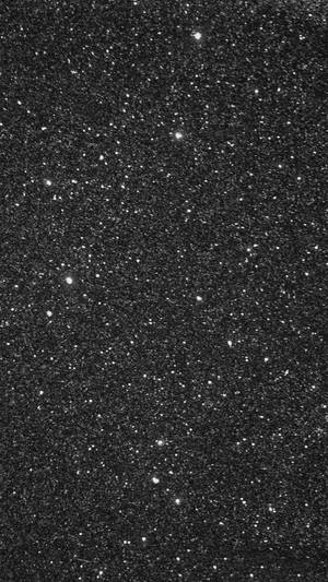 黑色背景上佈滿閃爍白色星星的星空夜空。