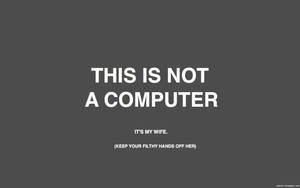 文字圖形，顯示「THIS IS NOT A COMPUTER」，下方有較小文字。