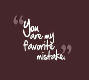 栗色背景上白色文字引文「You are my favorite mistake」。