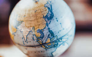 復古地球儀顯示亞洲及周邊地區，帶有詳細的地圖標籤。 — 世界地圖 壁紙