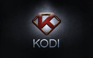 深色背景上帶有紅、金、銀金屬設計的 Kodi 媒體播放器標誌。