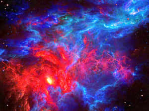 色彩繽紛的宇宙星雲，帶有發光的紅色和藍色雲層以及散落的星星。 — 史詩 壁紙