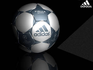 Adidas Champions League足球在帶有幾何陰影的黑色反光表面上。 — 高清足球 壁紙