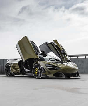 橄欖綠色McLaren跑車，鷗翼車門打開，停在混凝土表面上。 — 汽車 壁紙