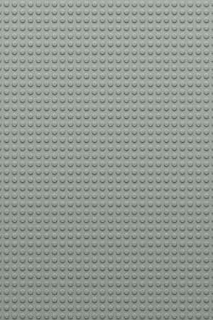 灰色LEGO底板，帶有重複的圓形凸點用於搭建。