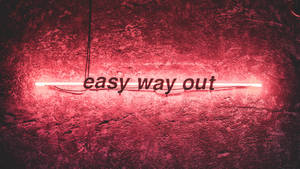紅色霓虹燈牌，上面寫著 easy way out，位於紋理牆上。