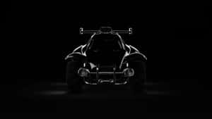 在黑暗的攝影棚中，聚光燈照亮了一個黑色沙丘越野車剪影。 — Studio Display 壁紙