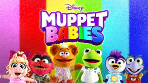 六個Muppet Babies角色喺彩虹背景前微笑。 — 布公仔大電影 GIF 壁紙
