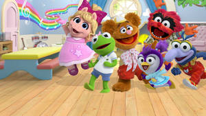 Muppet角色在色彩繽紛的教室中與彩虹音樂音符一起跳舞。 — 布公仔大電影 GIF 壁紙