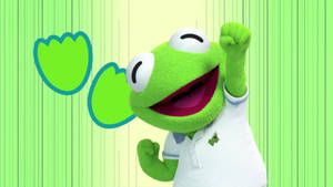Kermit the Frog 著住白色Polo衫，喺有鬱金香嘅綠色條紋背景上，笑住舉起拳頭。 — 布公仔大電影 GIF 壁紙