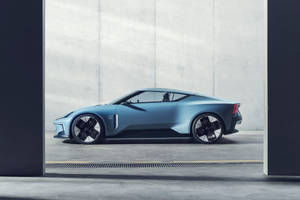 極簡混凝土車庫中的時尚藍色未來主義跑車。 — 汽車 壁紙