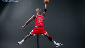 Michael Jordan動作人偶，身穿紅色公牛隊球衣，灌籃姿勢。 — 邁克爾·喬丹 壁紙