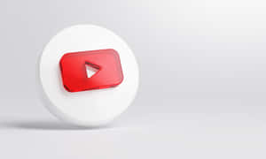 一個 3D YouTube 播放按鈕圖標放在白色底座上，背景是灰色。